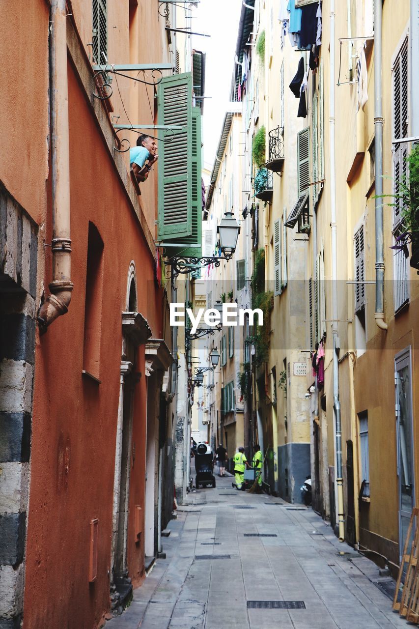 Narrow street amidst buildings in town