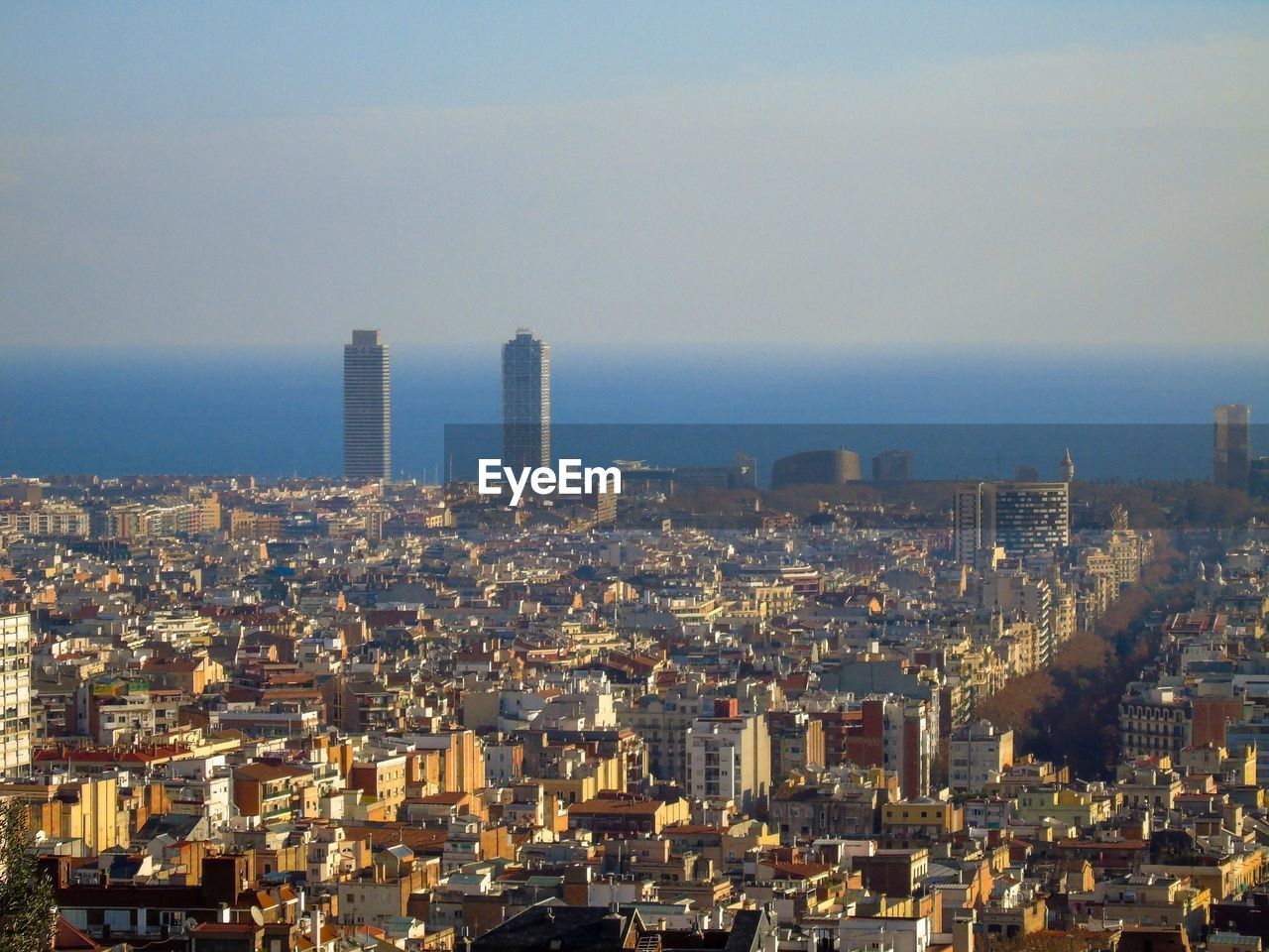 High angle view of modern buildings in city against sky