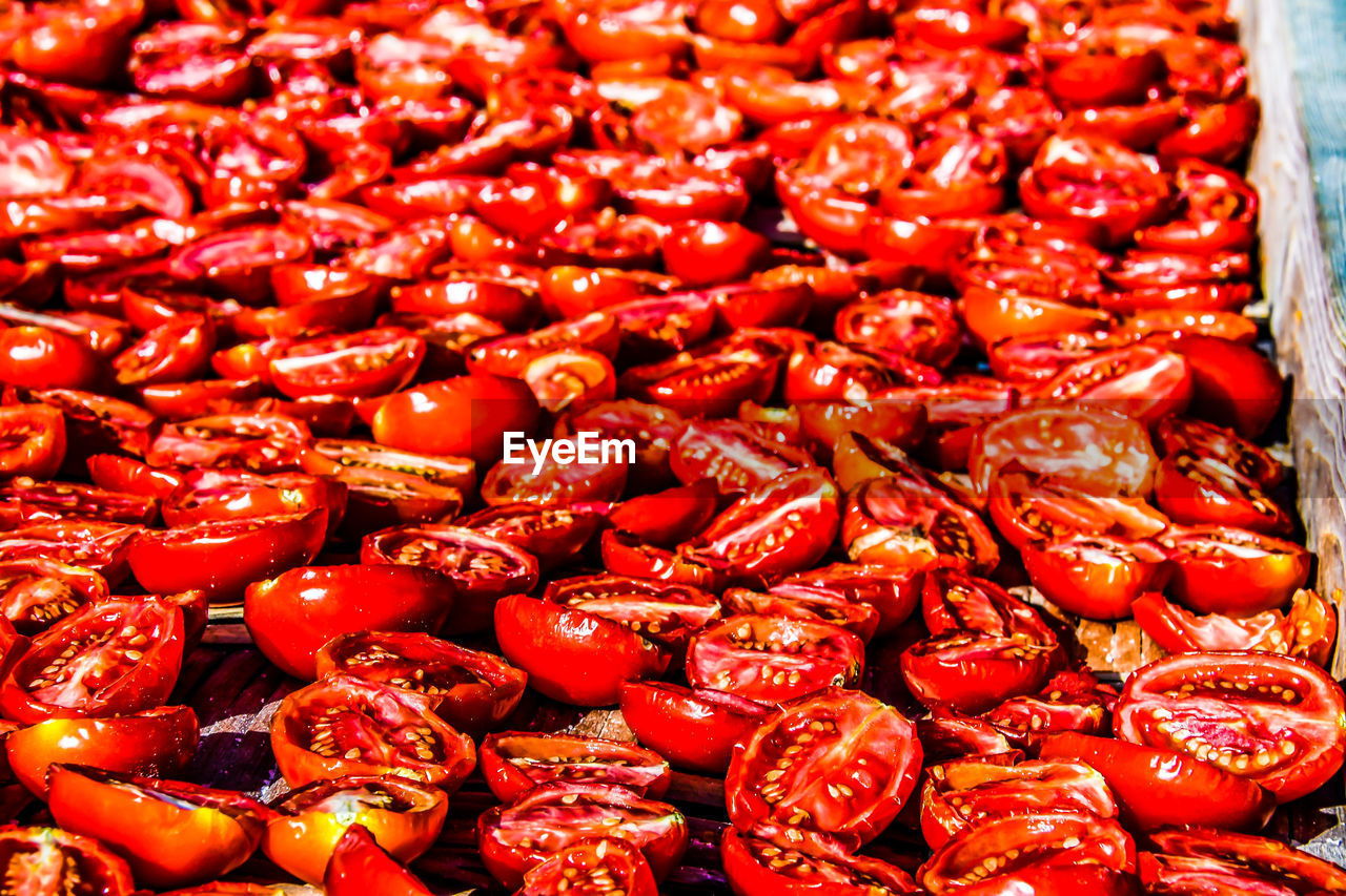 FULL FRAME SHOT OF RED CHILI PEPPERS AT MARKET