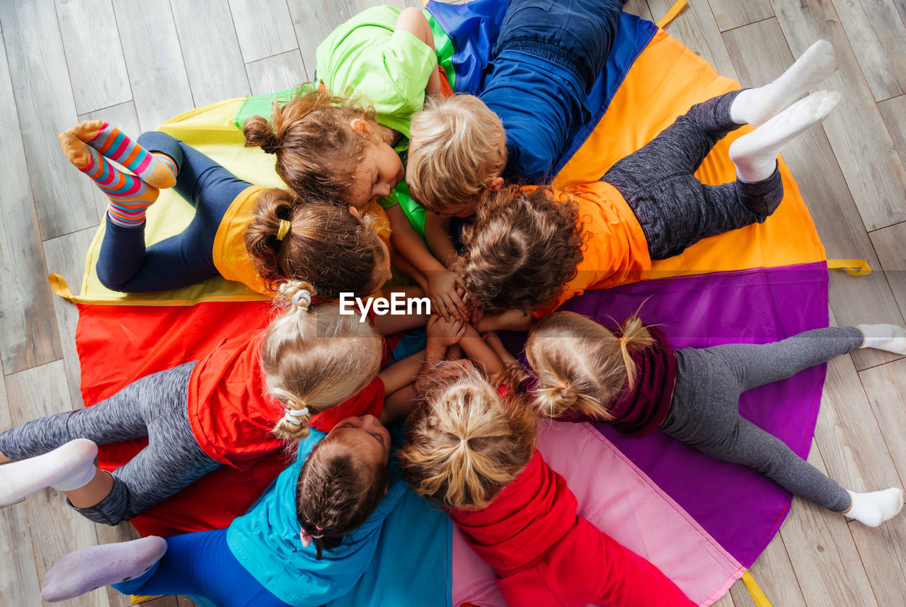 HIGH ANGLE VIEW OF PEOPLE RELAXING OUTDOORS