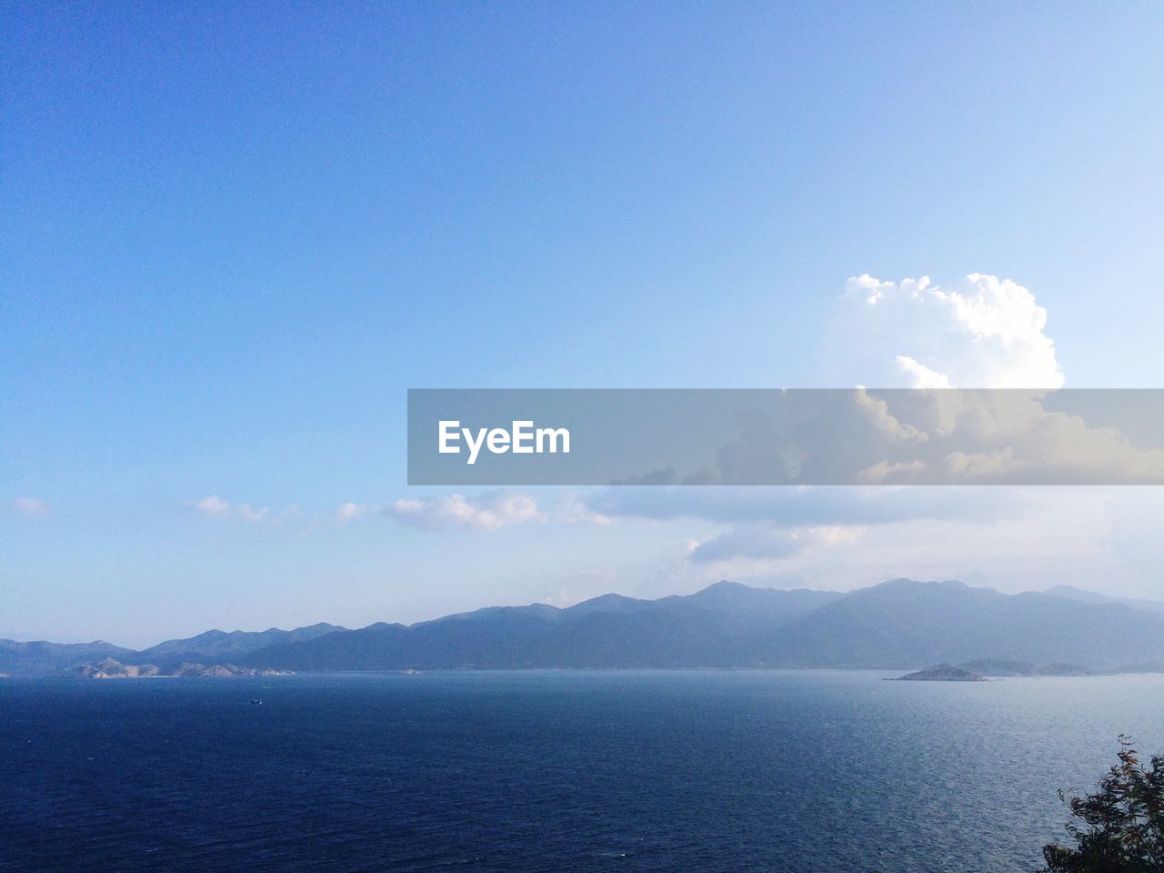 Scenic view of sea against blue sky