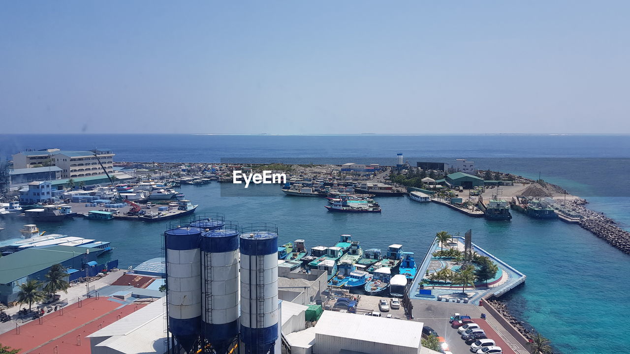 HIGH ANGLE VIEW OF HARBOR AGAINST SKY