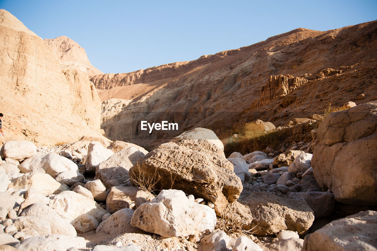 ROCK FORMATIONS ON LAND AGAINST SKY