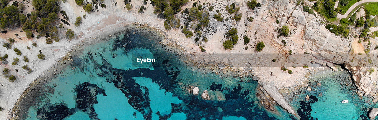 High angle view of sea against rock formation