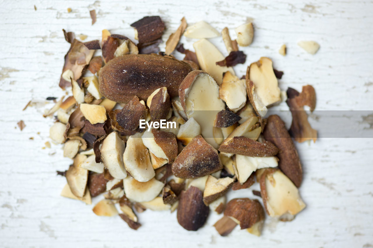 High angle close-up of nuts on old wooden table