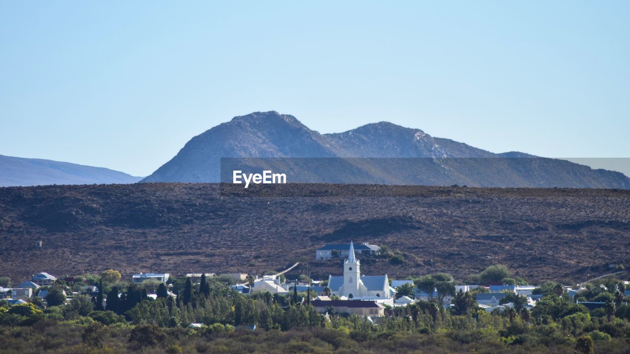 SCENIC VIEW OF MOUNTAINS AGAINST CLEAR SKY