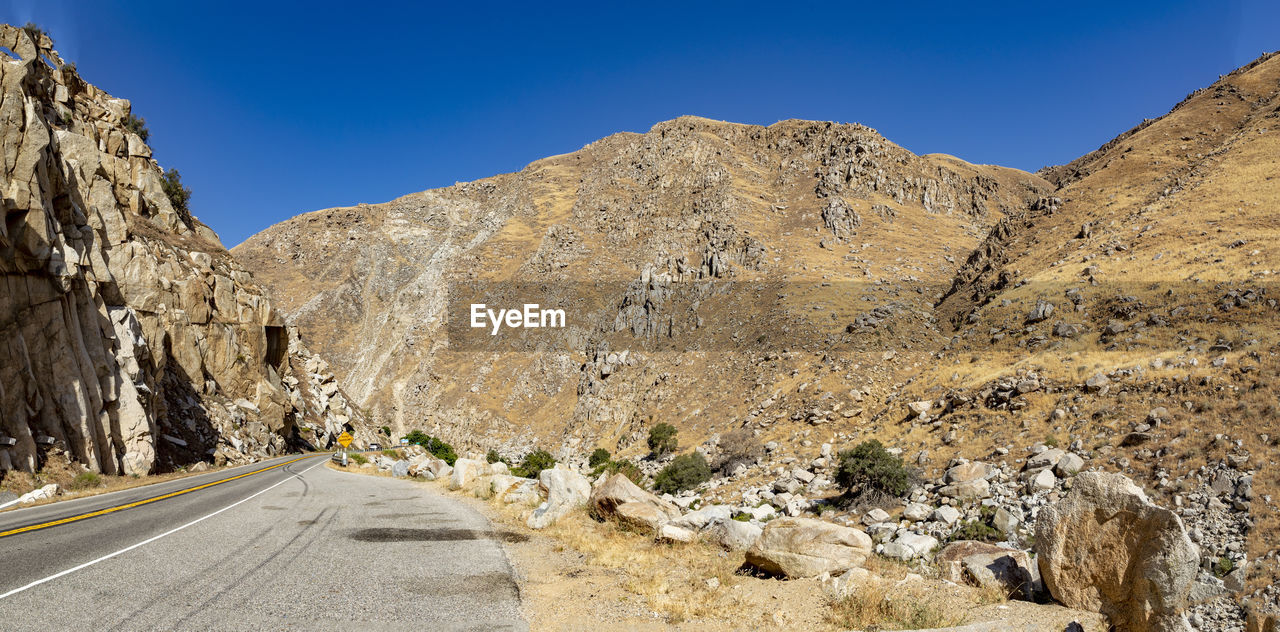 scenic view of mountains against clear blue sky