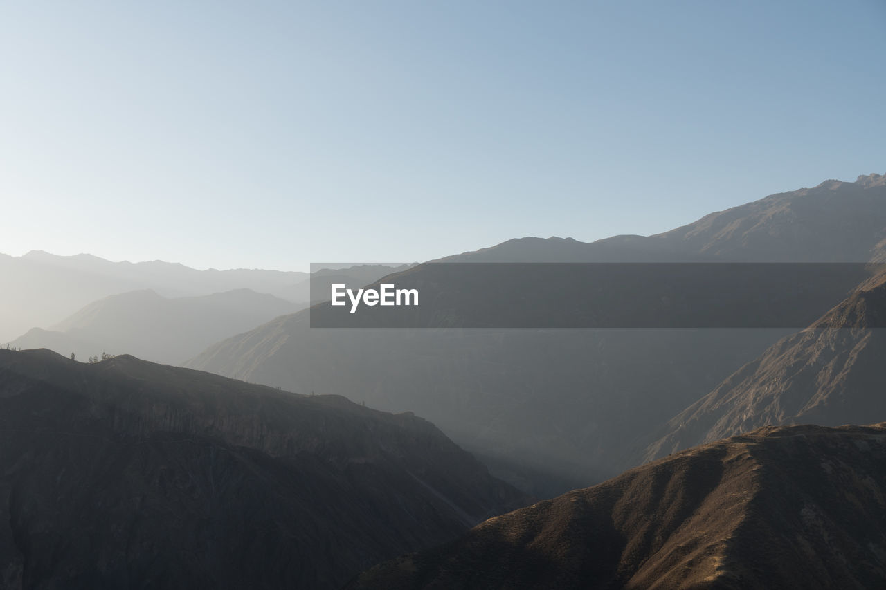 Scenic view of mountains against clear sky