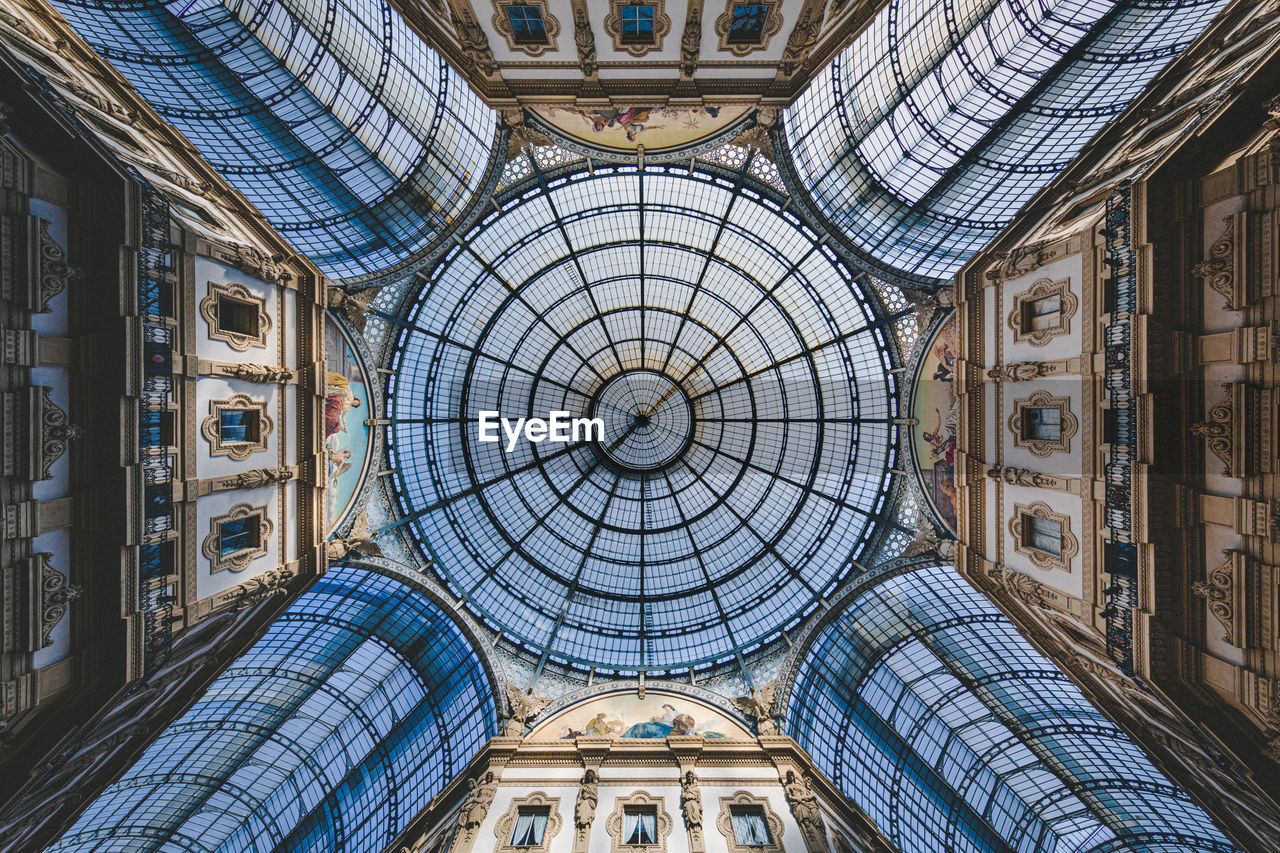 Low angle view of ceiling of historical building in milan