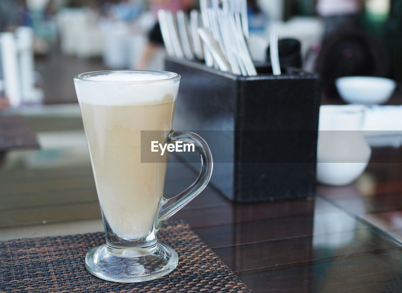 CLOSE-UP OF COFFEE ON TABLE