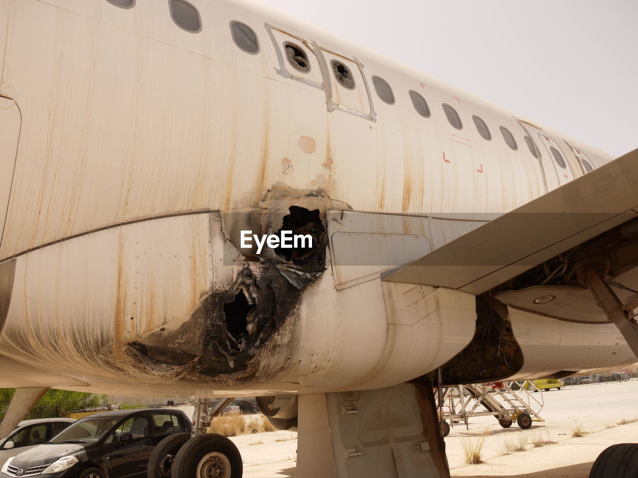 Low angle view of abandoned airplane against sky