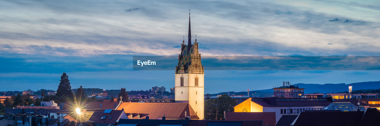 VIEW OF ILLUMINATED BUILDINGS AGAINST SKY