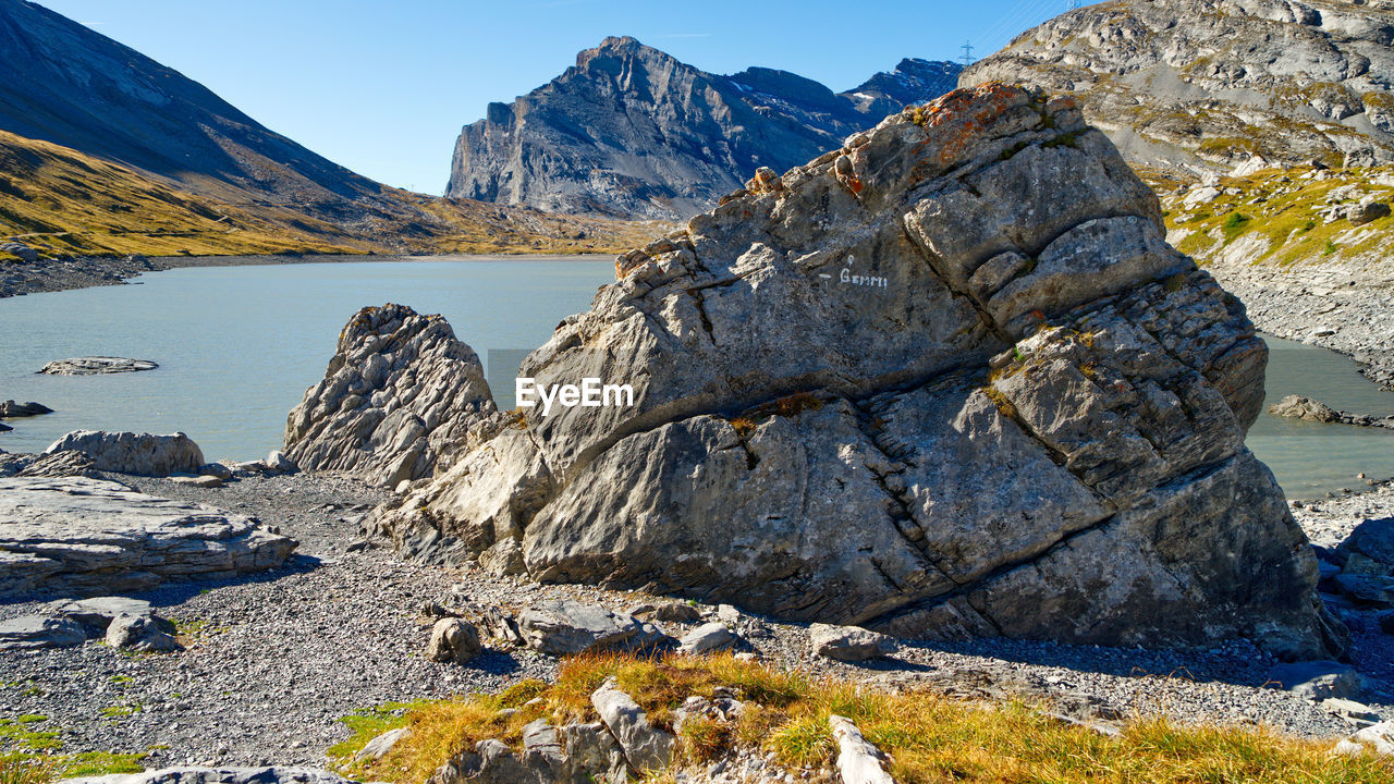 Scenic view of rocks in mountains against sky