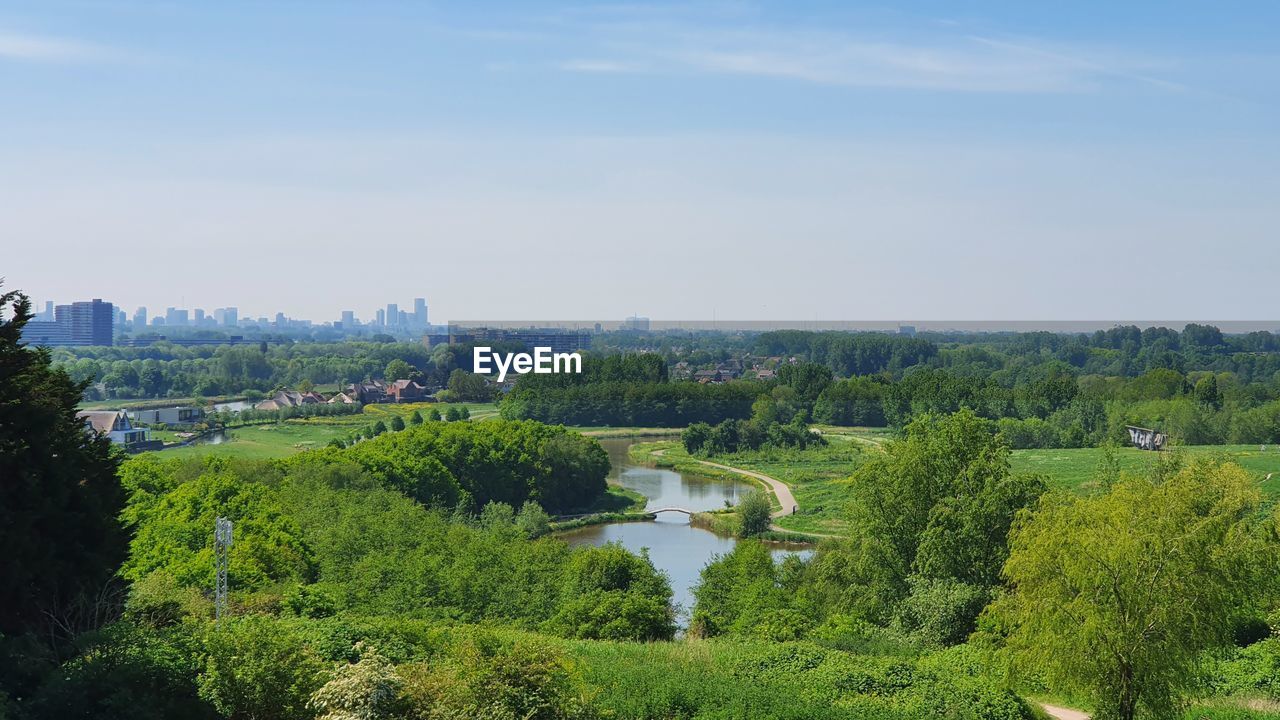 HIGH ANGLE VIEW OF FIELD AGAINST SKY