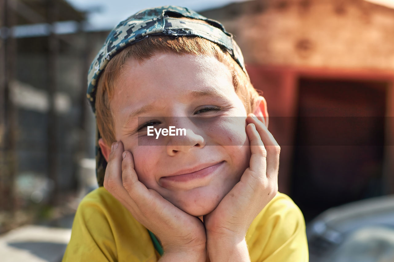 Close-up portrait of smiling boy