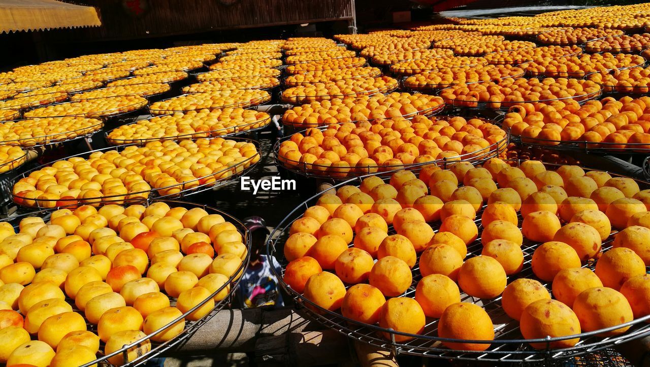 Close-up of persimmons for sale in market