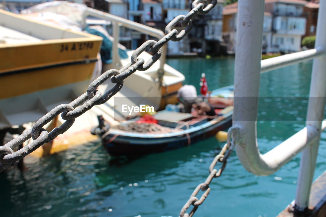 Scenic view of harbor from a ship with a chain link