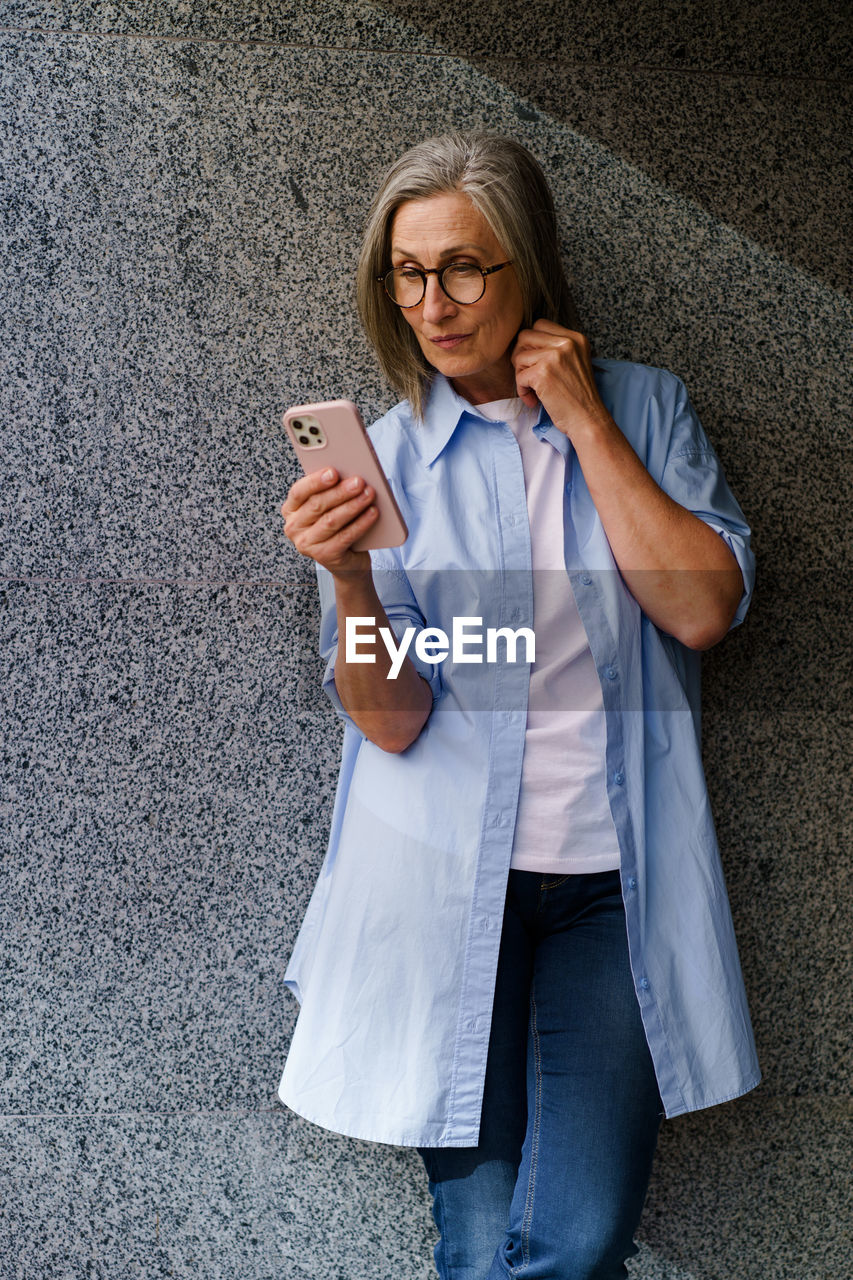 portrait of young woman using mobile phone