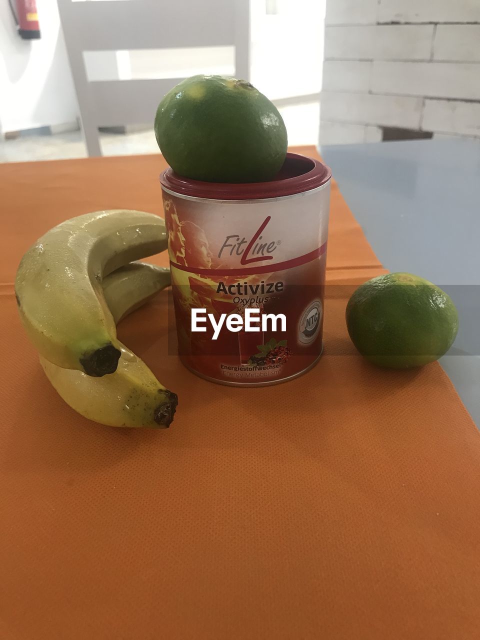 HIGH ANGLE VIEW OF FRUITS IN CONTAINER ON TABLE