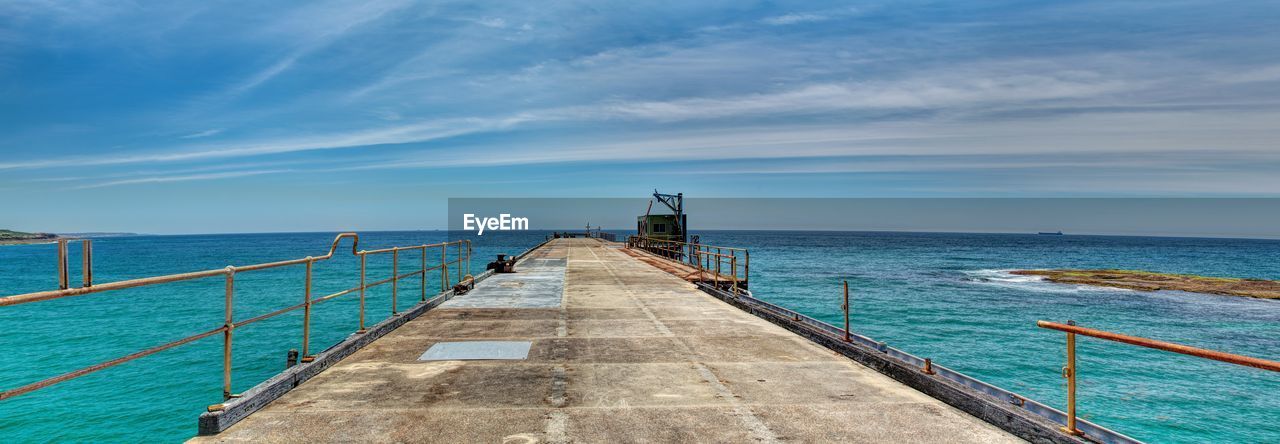 Scenic view of sea against blue sky