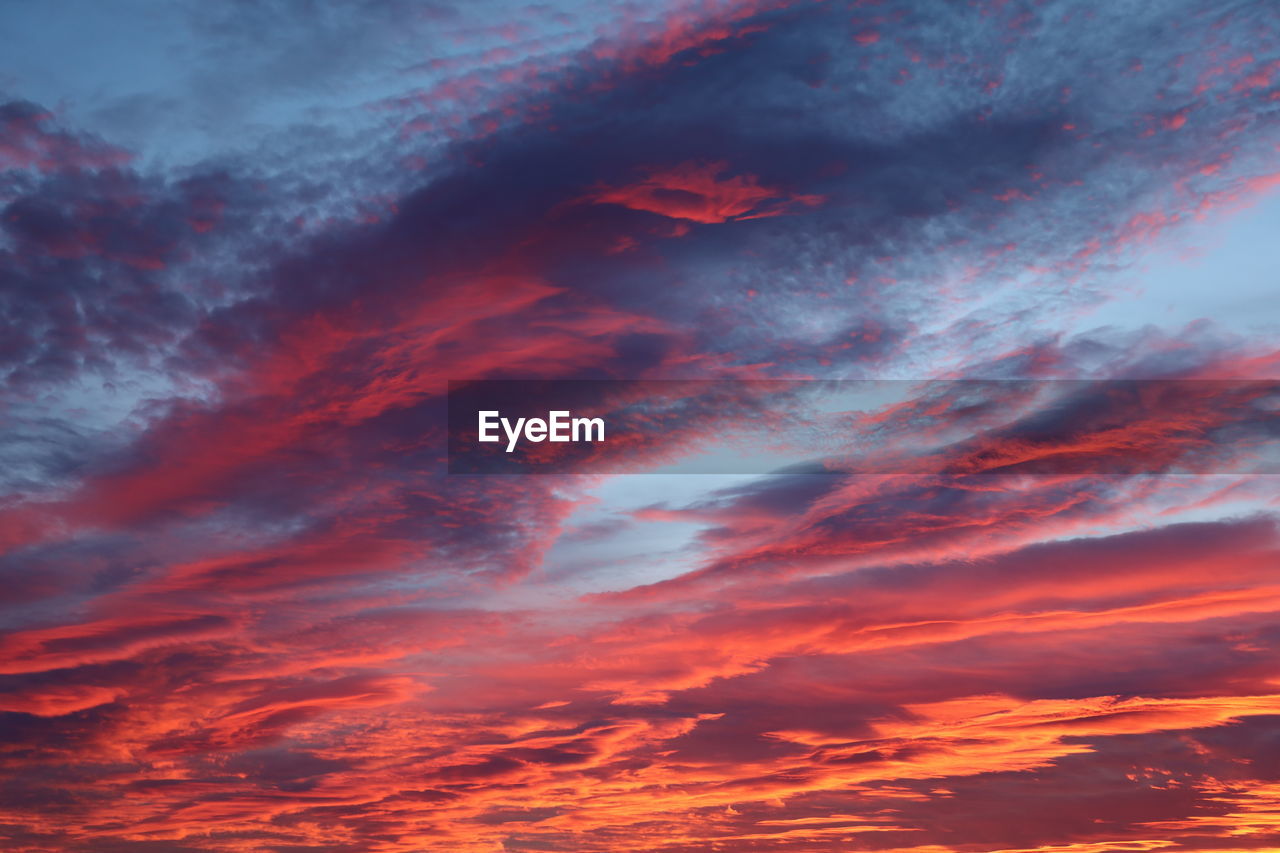 Low angle view of dramatic sky during sunset