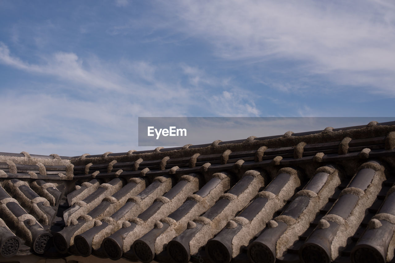 LOW ANGLE VIEW OF ROOF TILES