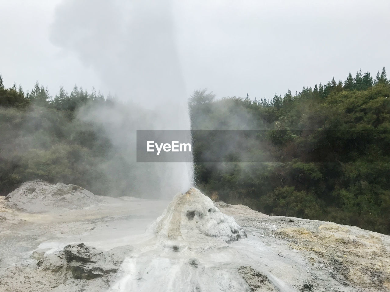 SCENIC VIEW OF WATERFALL ON MOUNTAIN