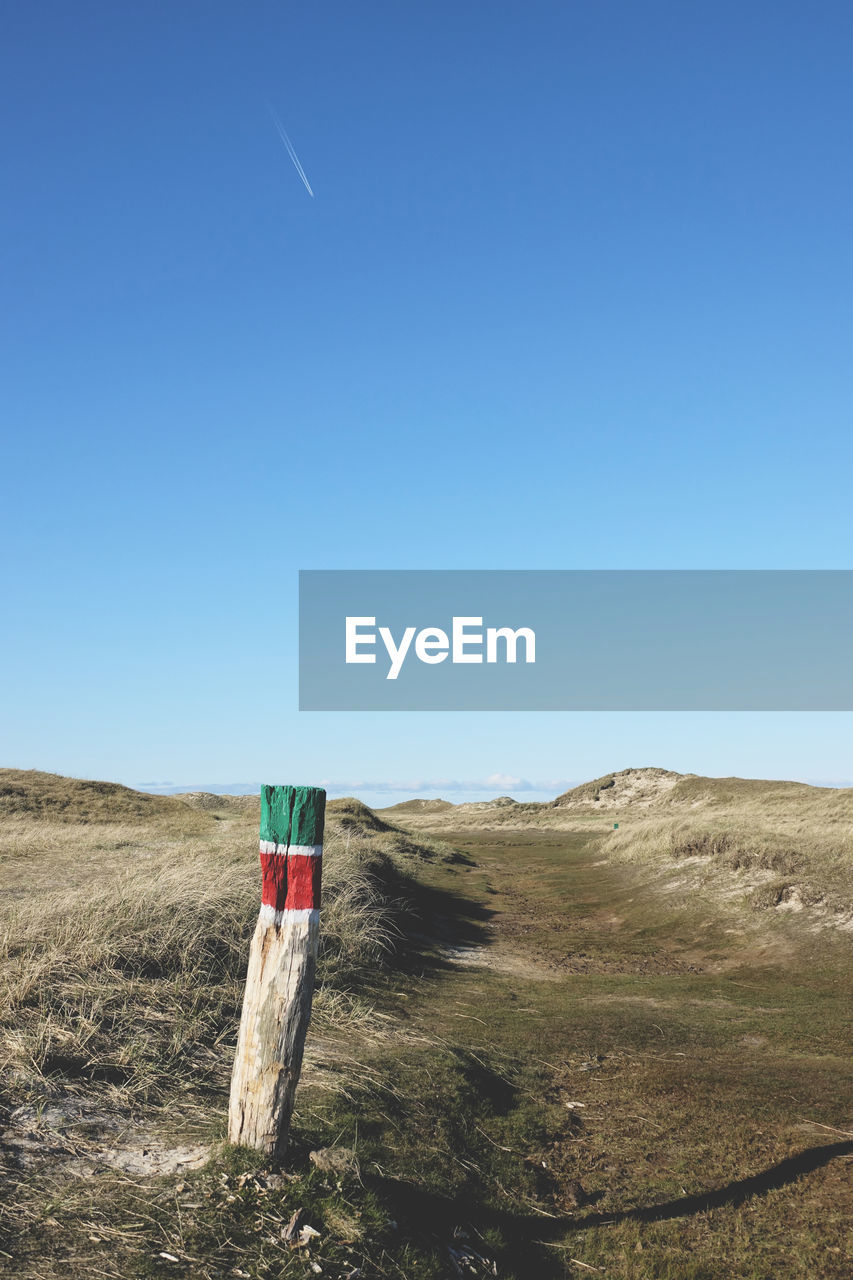 Scenic view of landscape against clear blue sky