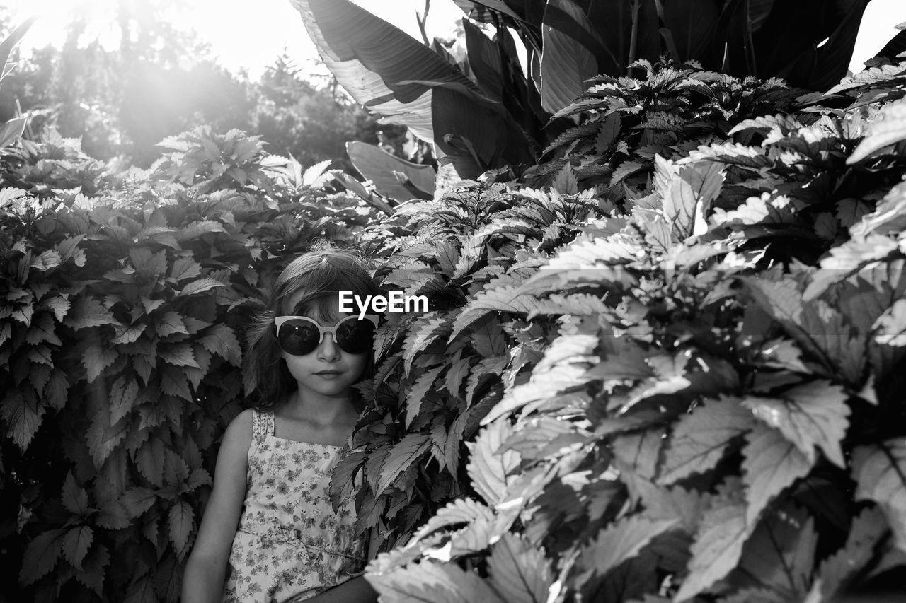 Girl amidst plants at park