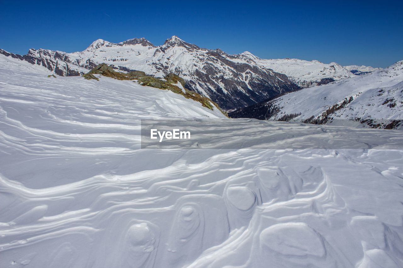 Scenic view of snow covered mountains