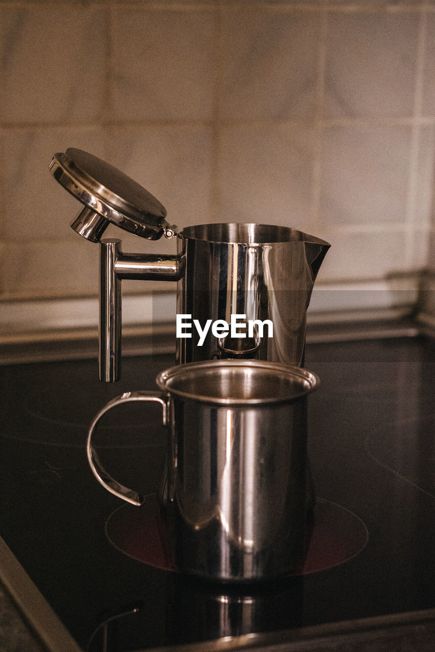 Close-up of coffee kettle on table