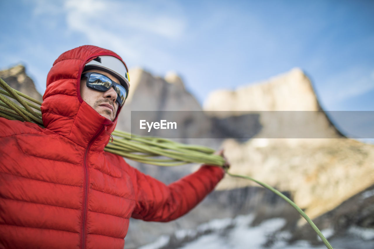 Climber coils rope after a successful climb