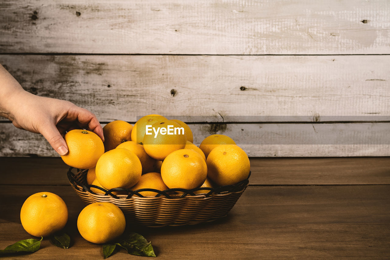 MAN HOLDING FRUITS