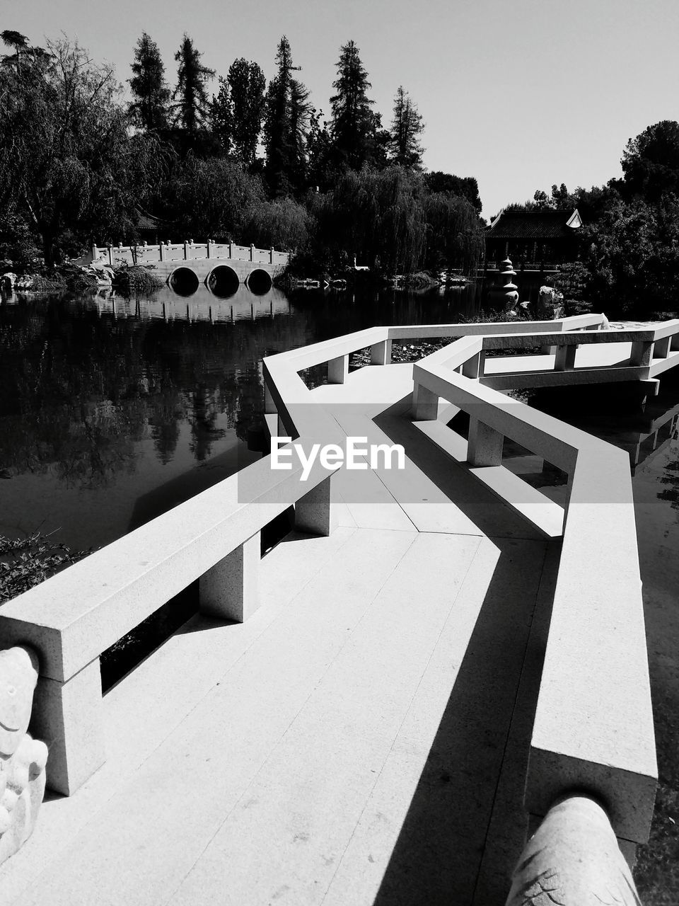 Black and white photo of a bridge over water