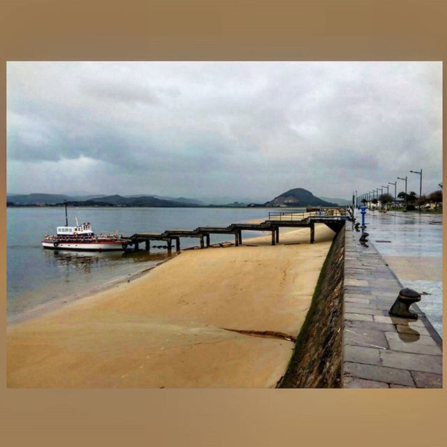 VIEW OF PIER ON SEA AGAINST CLOUDY SKY