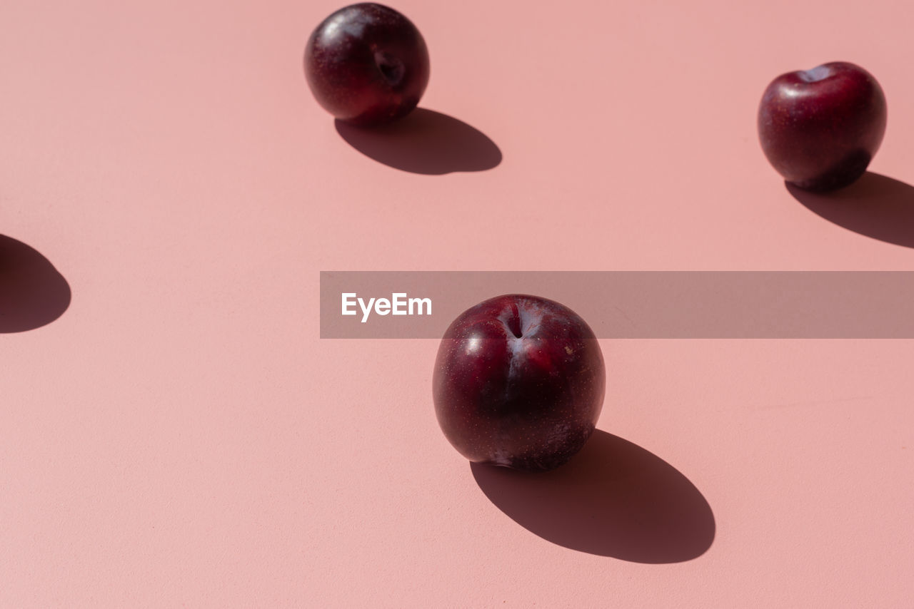 Close-up of plums on table