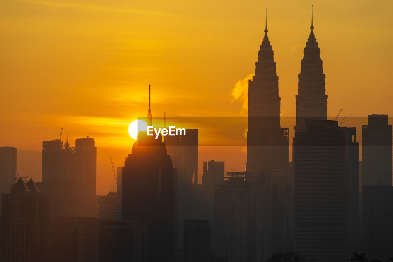 BUILDINGS IN CITY DURING SUNSET