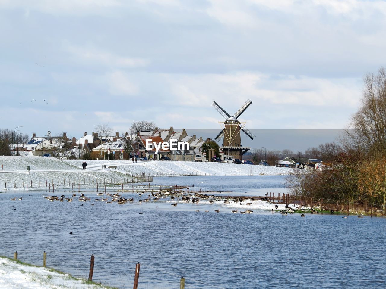 windmill, renewable energy, wind power, alternative energy, wind turbine, environmental conservation, turbine, water, environment, power generation, sky, nature, architecture, snow, traditional windmill, winter, sea, day, built structure, mill, cloud, wind, no people, beauty in nature, cold temperature, landscape, outdoors, building exterior, land, coast