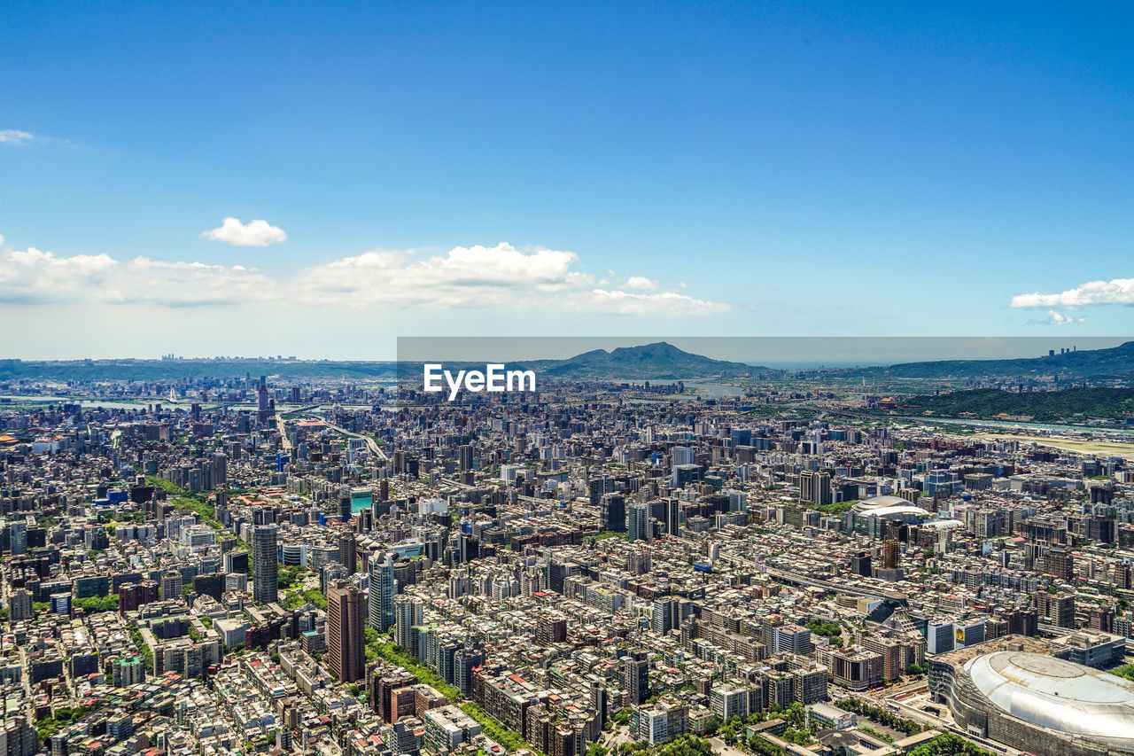 aerial view of cityscape against sky