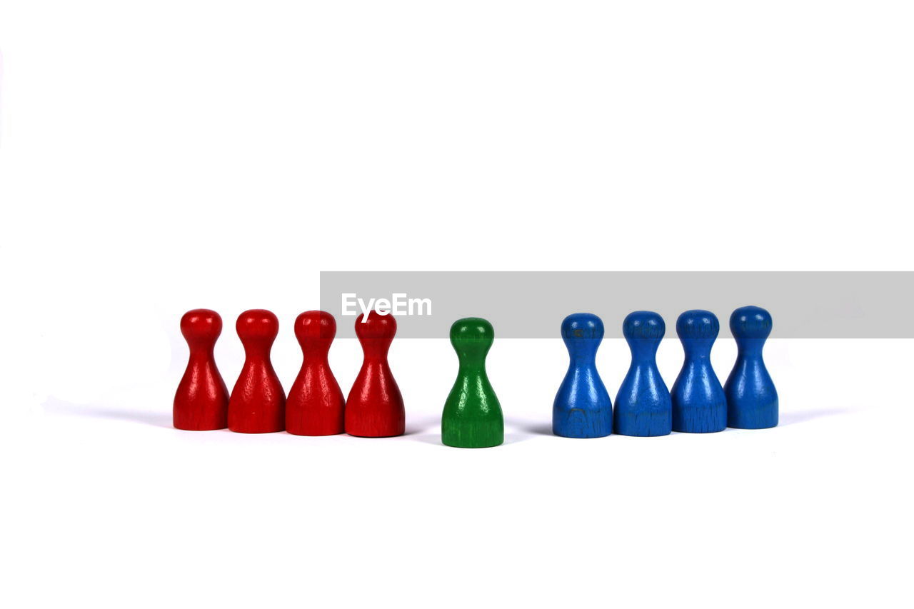 Colorful game pieces over white background
