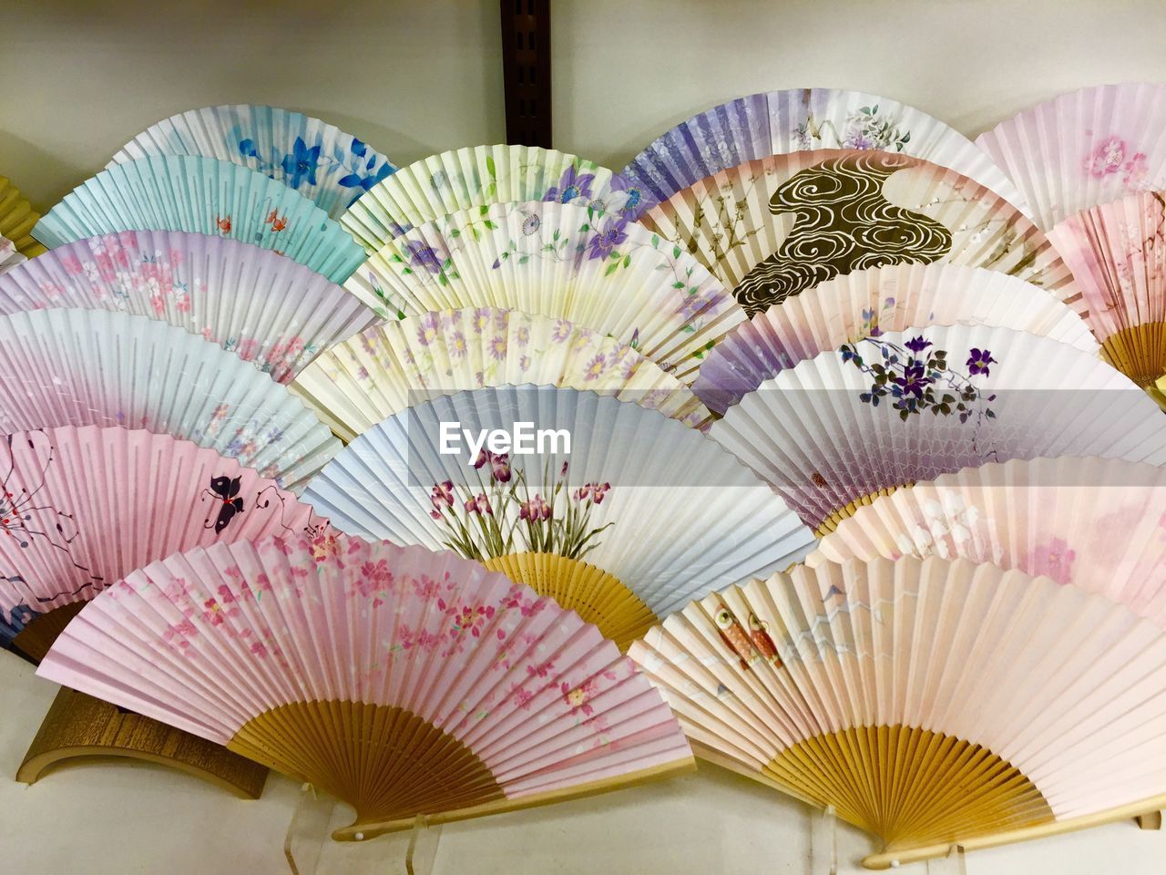 Close-up of colorful hand fans