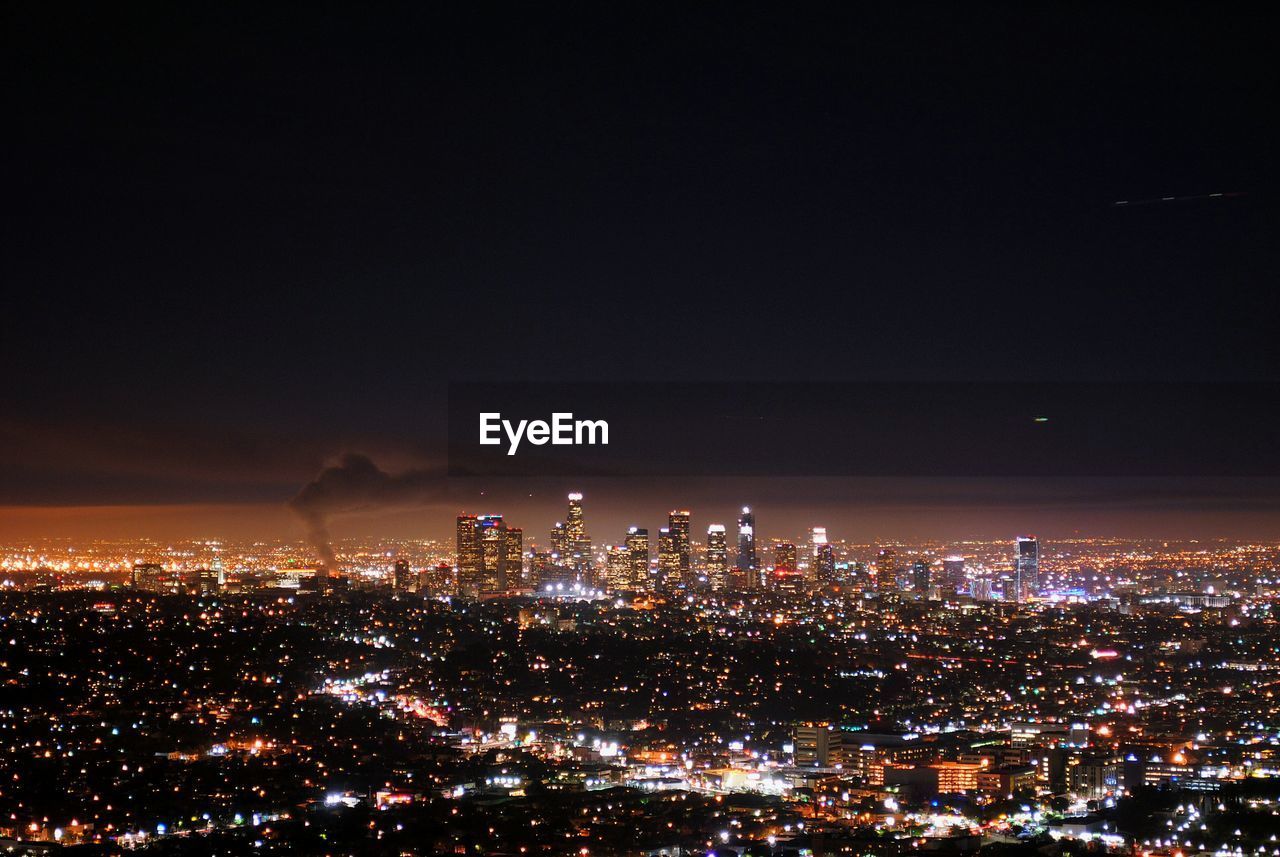 Aerial view of illuminated city at night