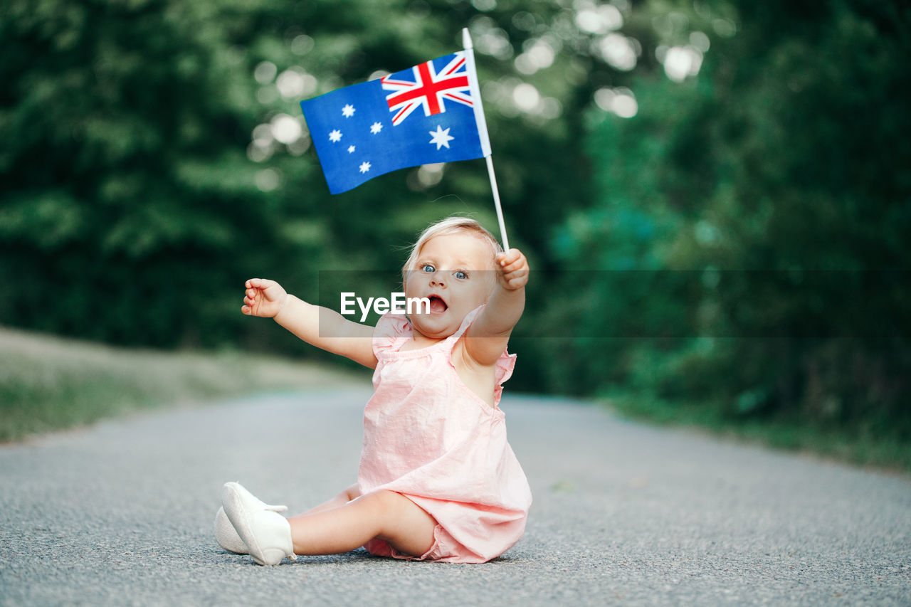 Cute girl looking away flag