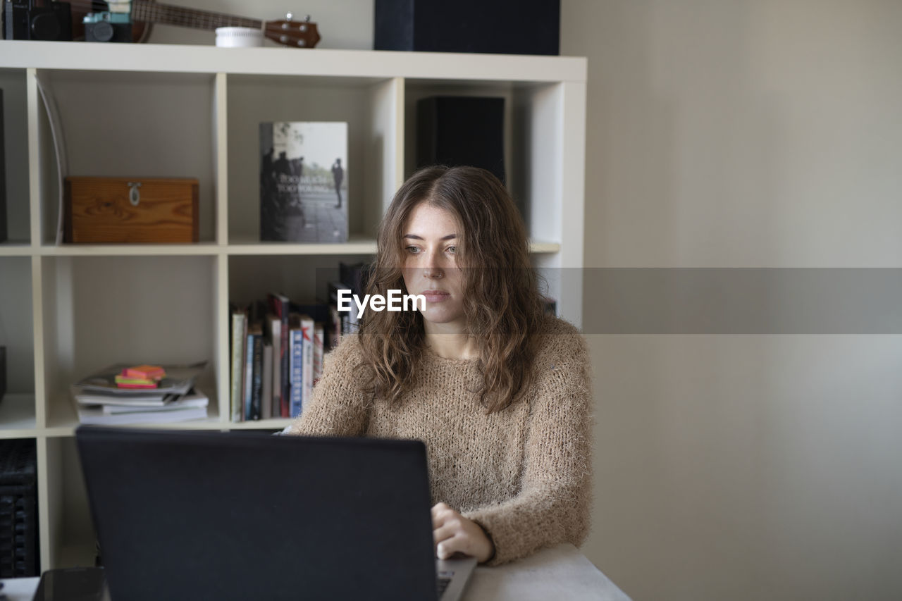 Young woman using laptop