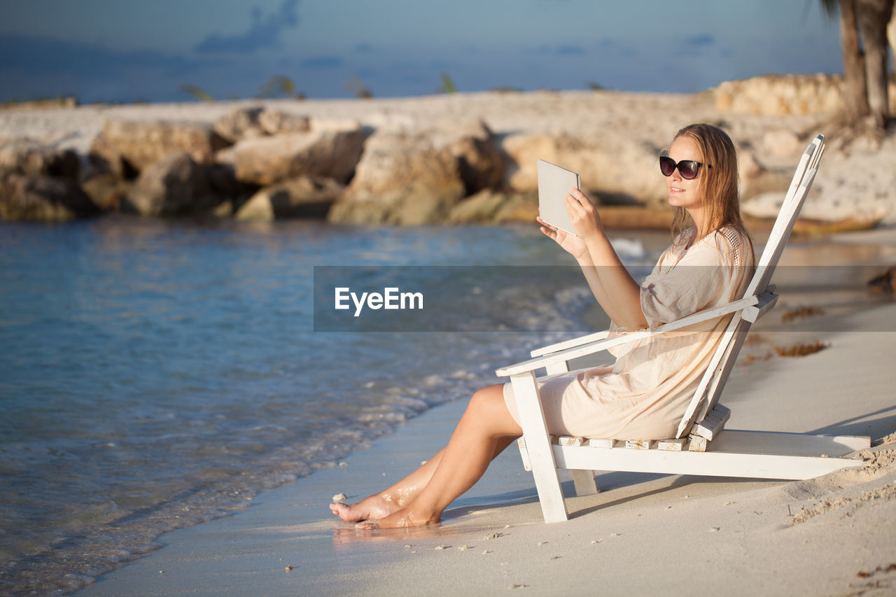 Young woman relaxing on beach