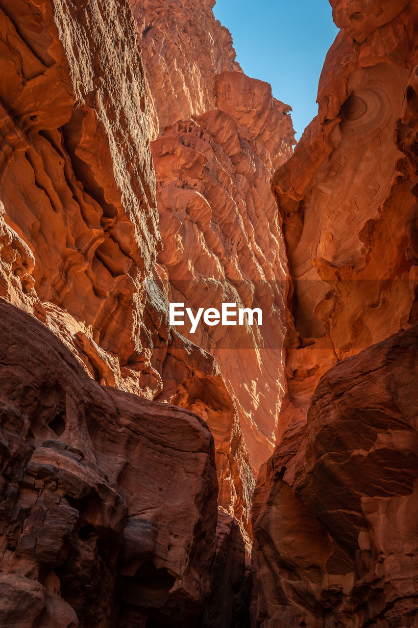 LOW ANGLE VIEW OF ROCK FORMATION IN A CANYON