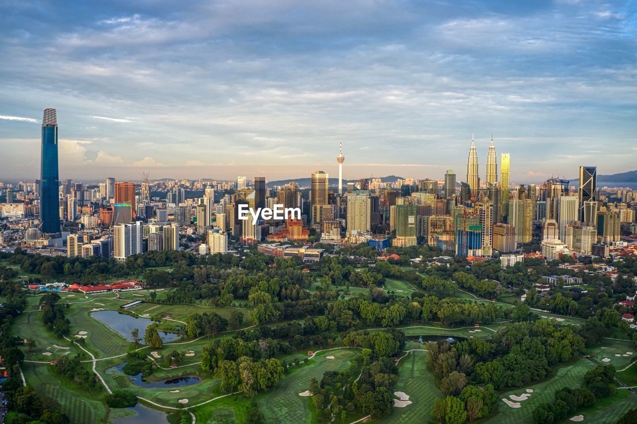 High angle view of buildings in city against sky