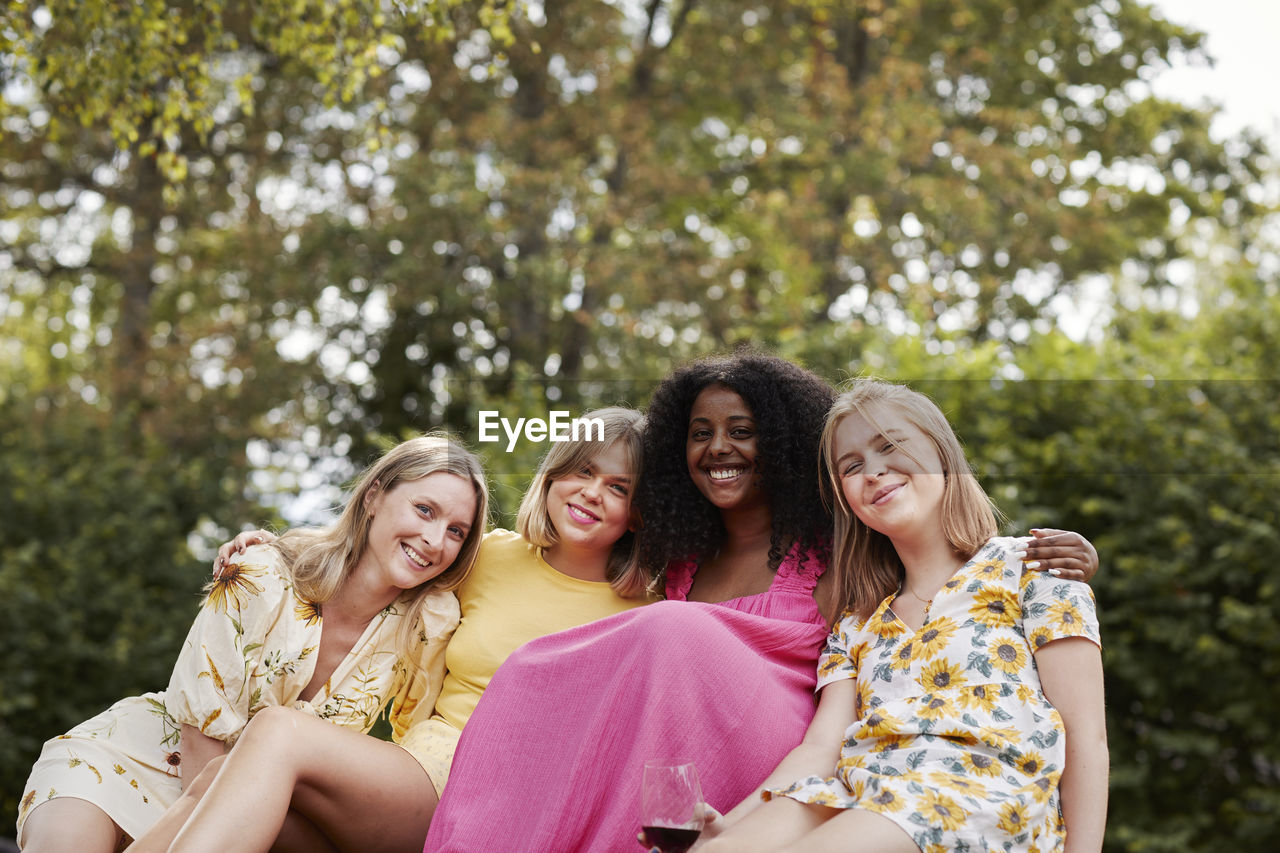 Group of friends resting in forest