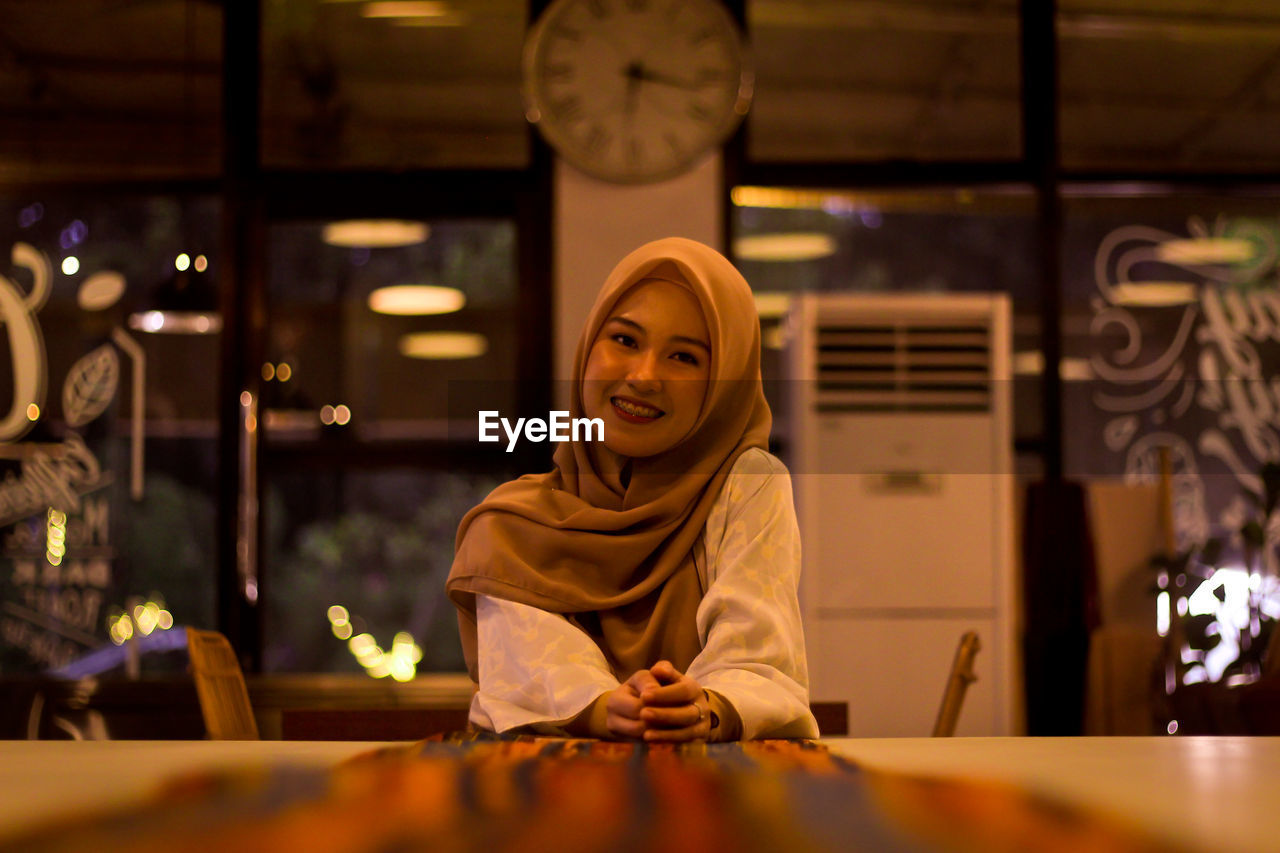Portrait of smiling woman at restaurant