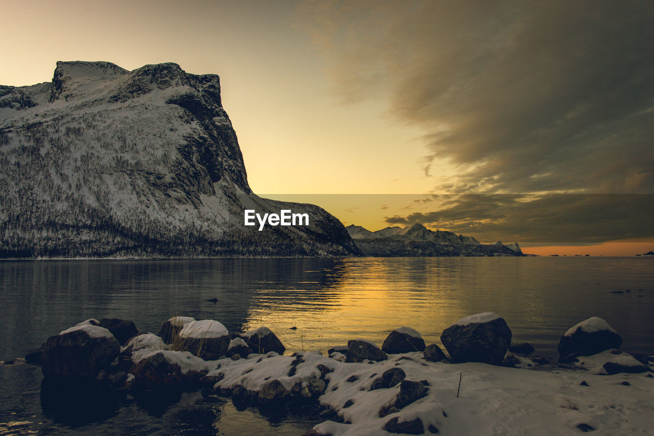 Scenic view of lake against sky during sunset